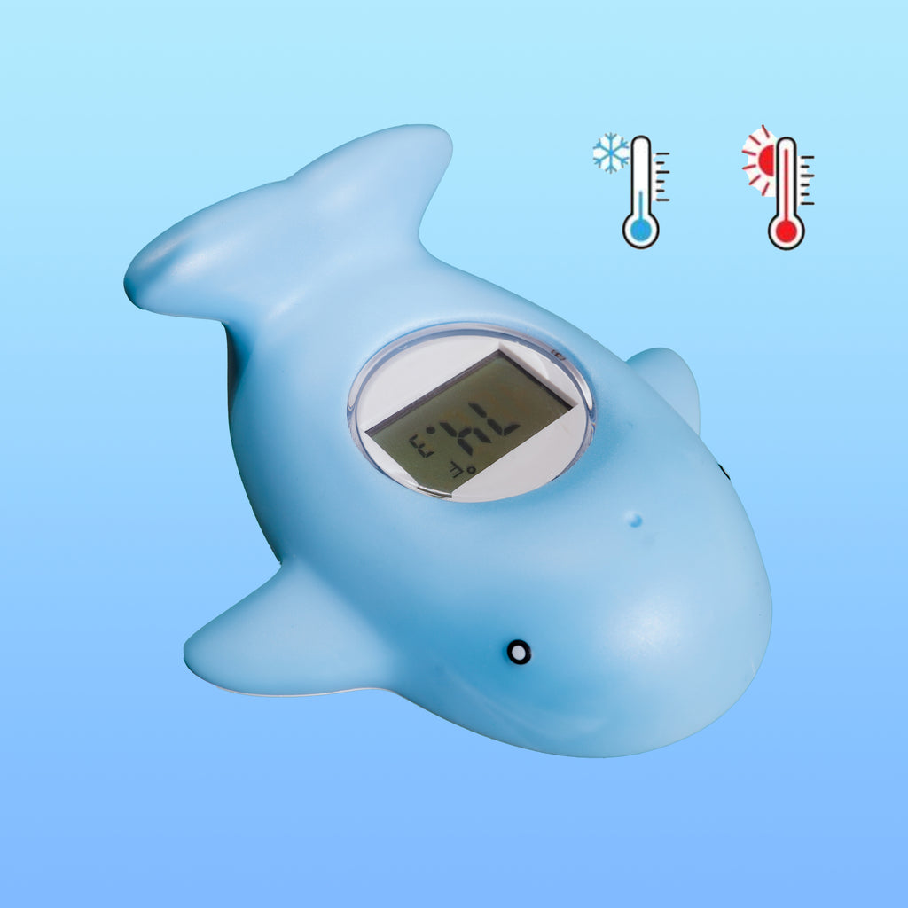 Blue Tubee Whale Thermometer floating in a baby bath tub, perfect for monitoring water temperature in any safety bathtub or the bath tub.