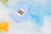 Blue Tubee Whale Thermometer floating in a baby bath tub, perfect for monitoring water temperature in any safety bathtub or the bath tub.