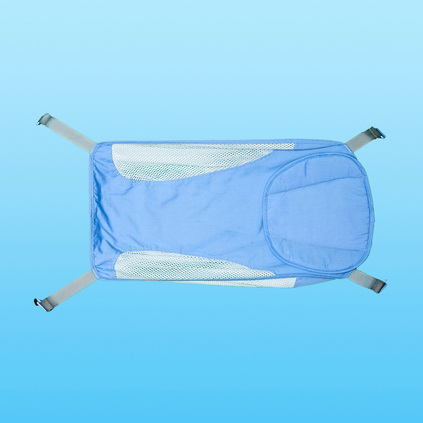 Baby resting in Tubee Blue Hammock inside a safety bathtub, supported comfortably in the bath tub during bath time